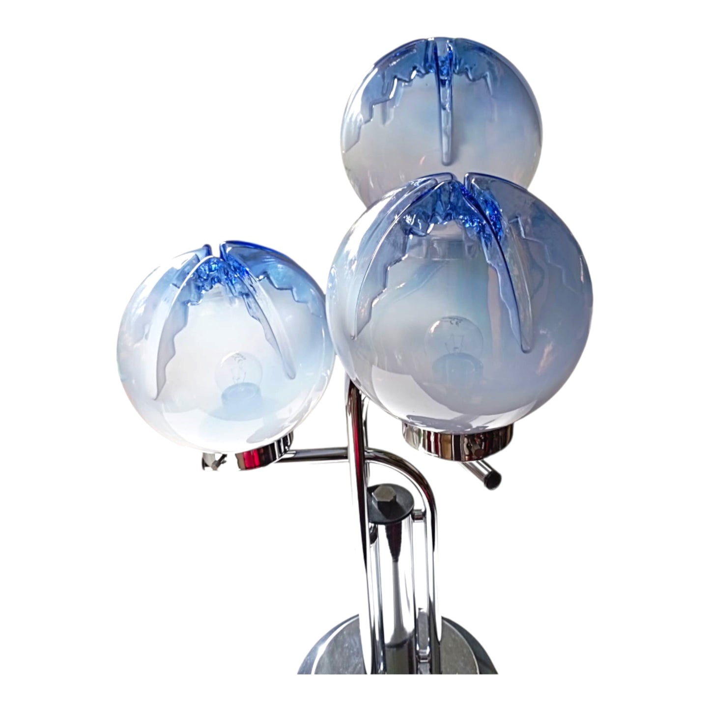 Close-up view of textured blown glass globes with blue tones