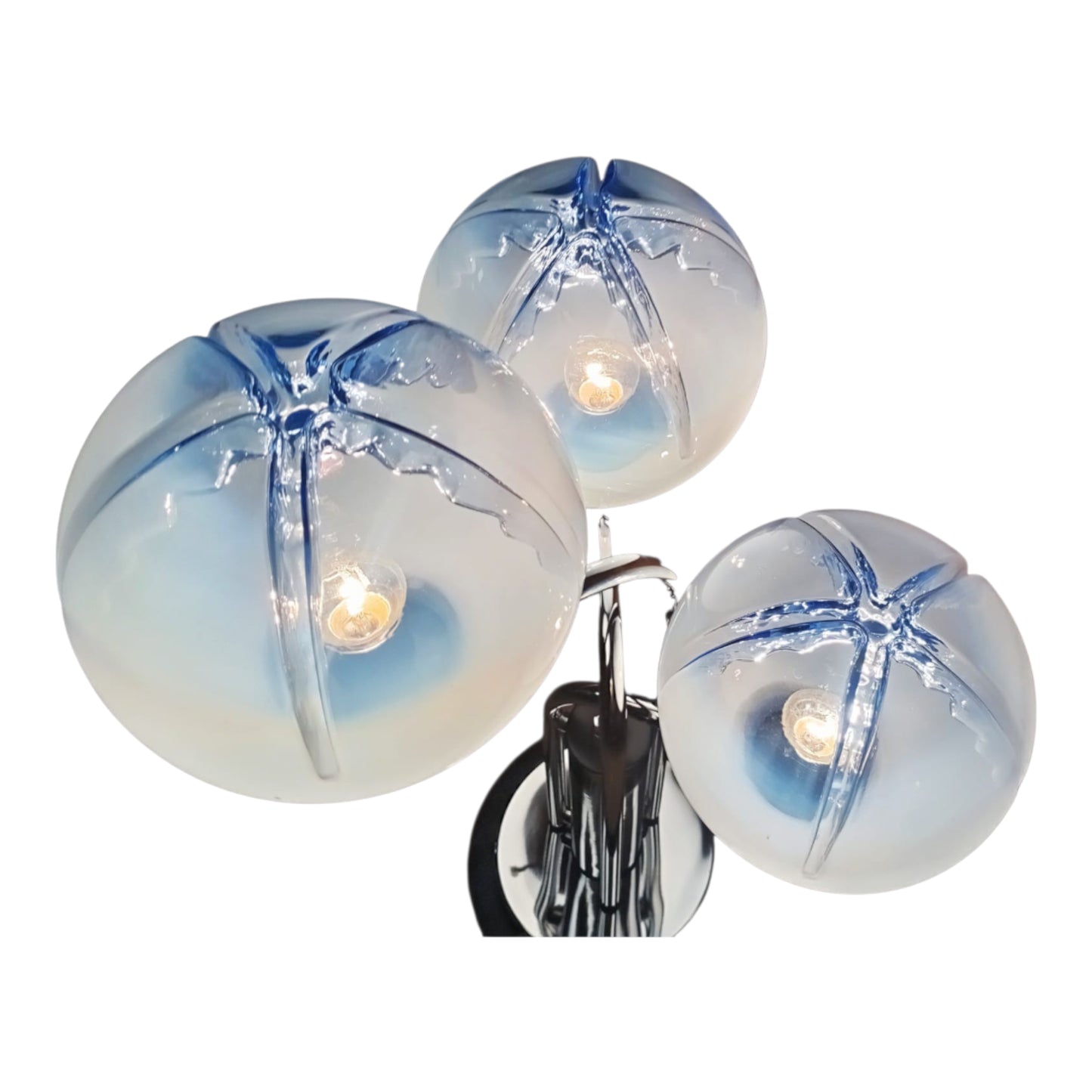 Close-up view of textured blown glass globes with blue tones