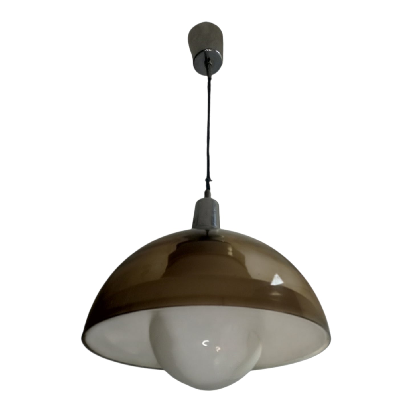 Vintage smoked pendant light suspended against a white interior