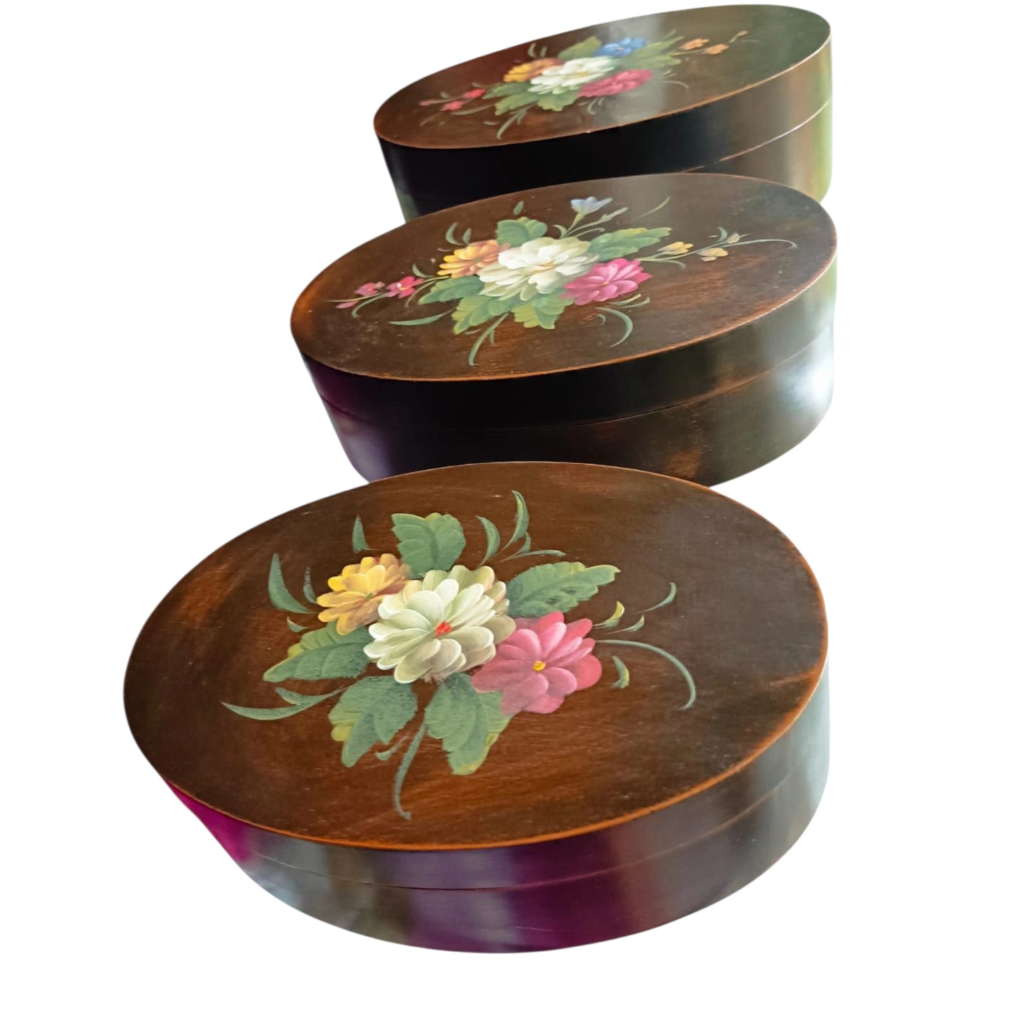 Three oval wooden boxes stacked together 