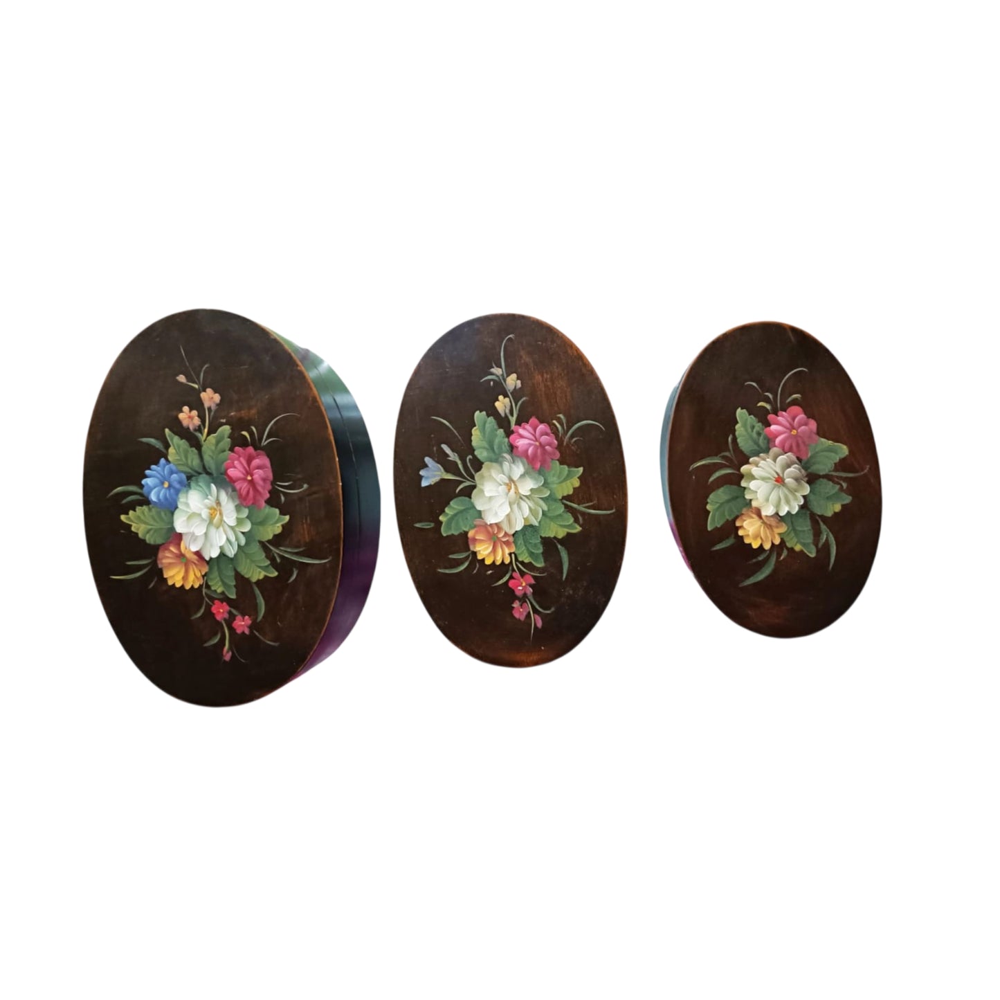 Graduated floral wooden boxes shown closed 