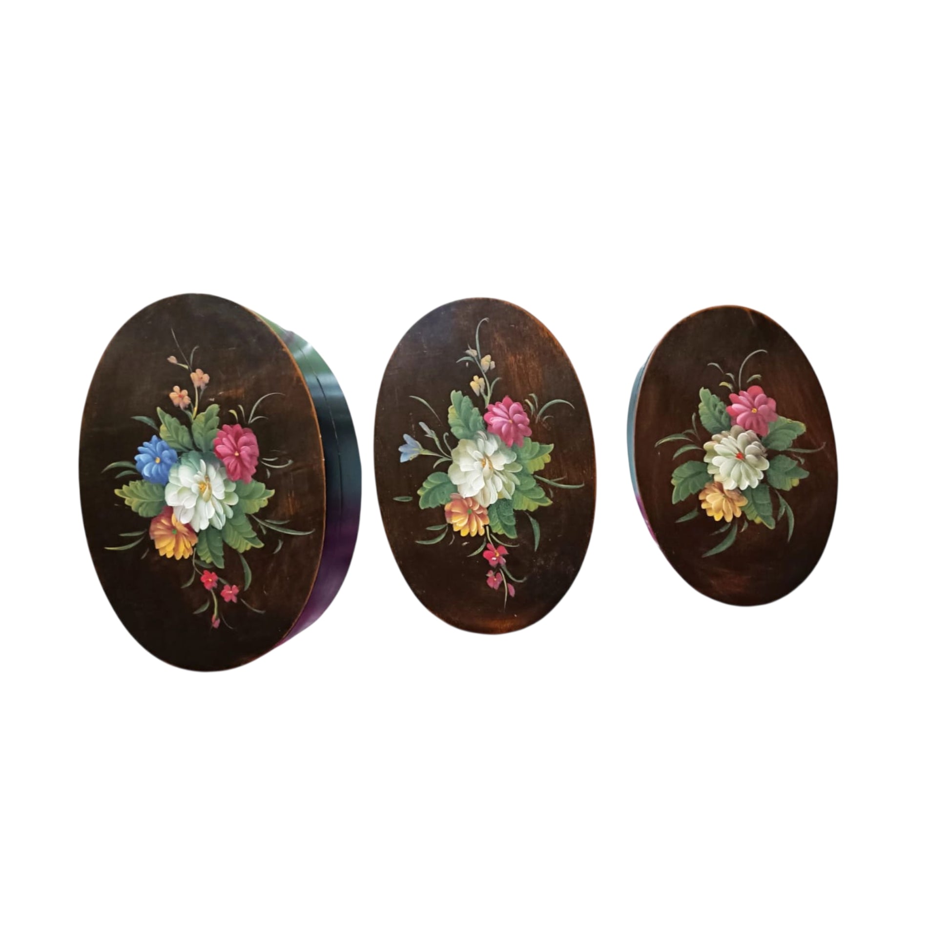 Graduated floral wooden boxes shown closed 