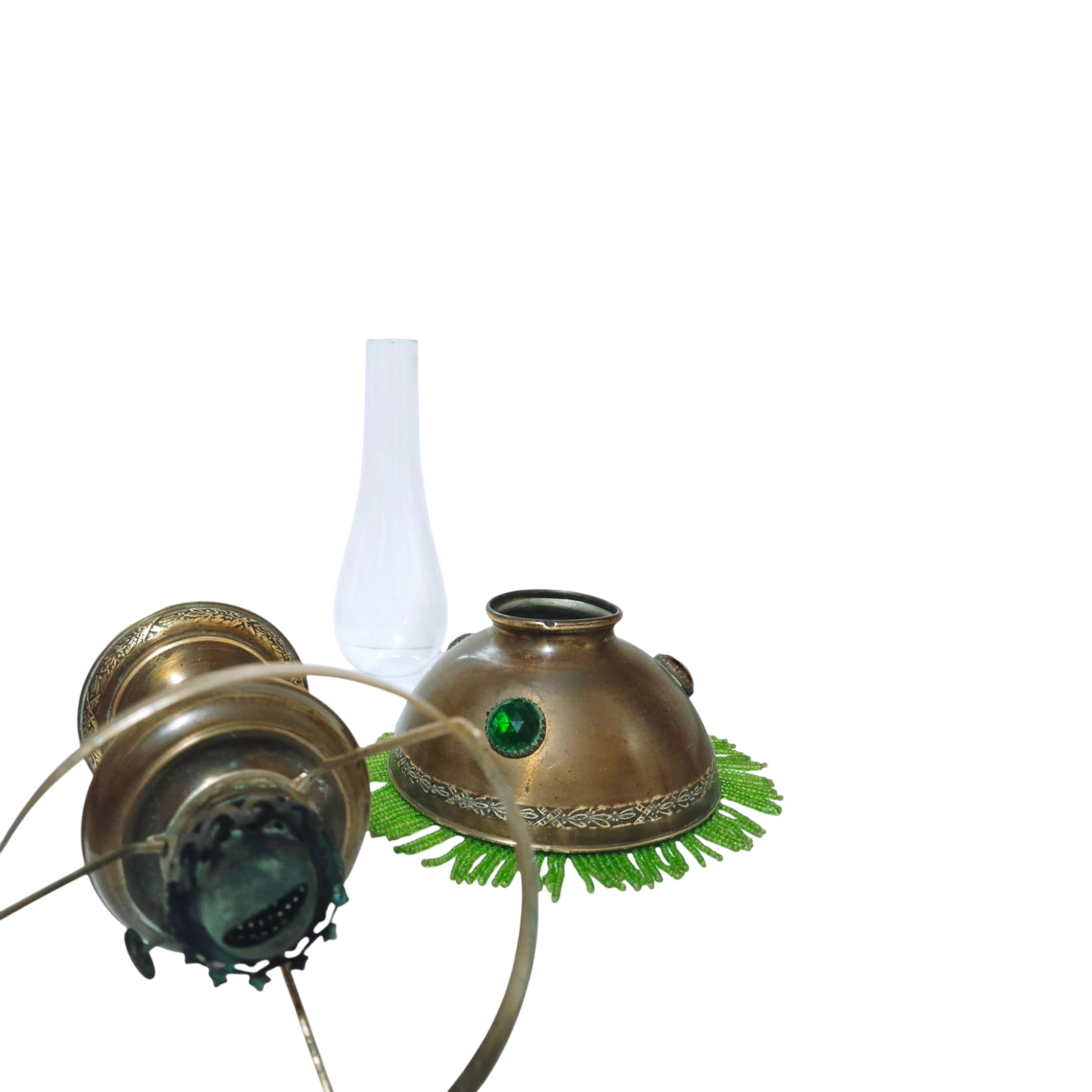Antique oil lamp shown with the glass chimney and shade removed