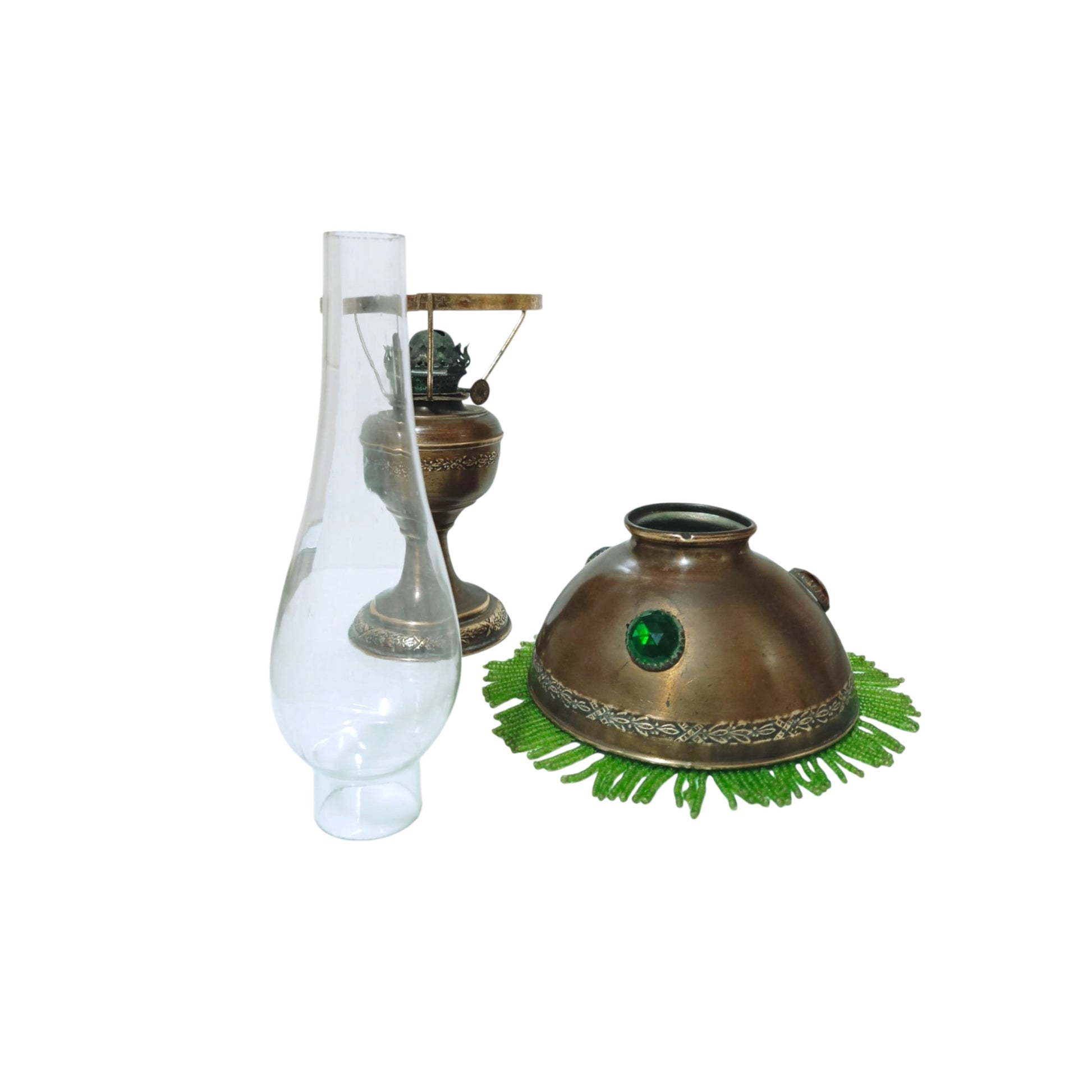 Antique oil lamp shown with the glass chimney and shade removed