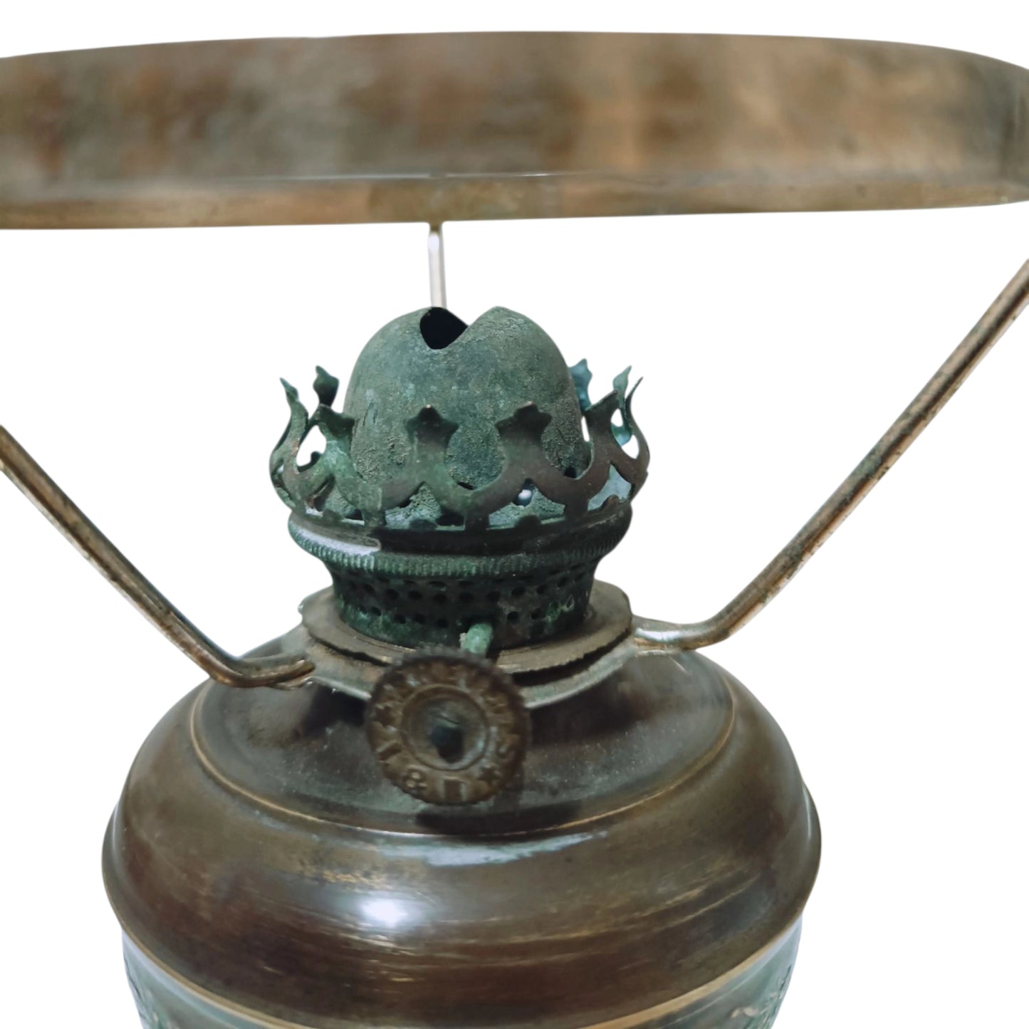 Close view of the metal burner and wick mechanism
