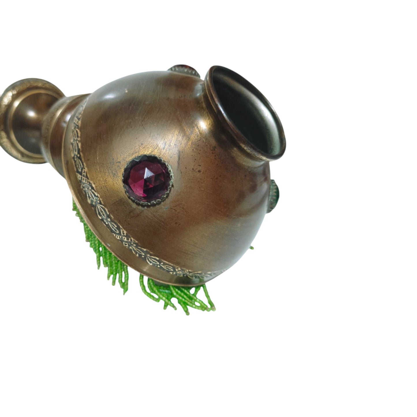 Detail of bronze oil lamp with coloured cabochons