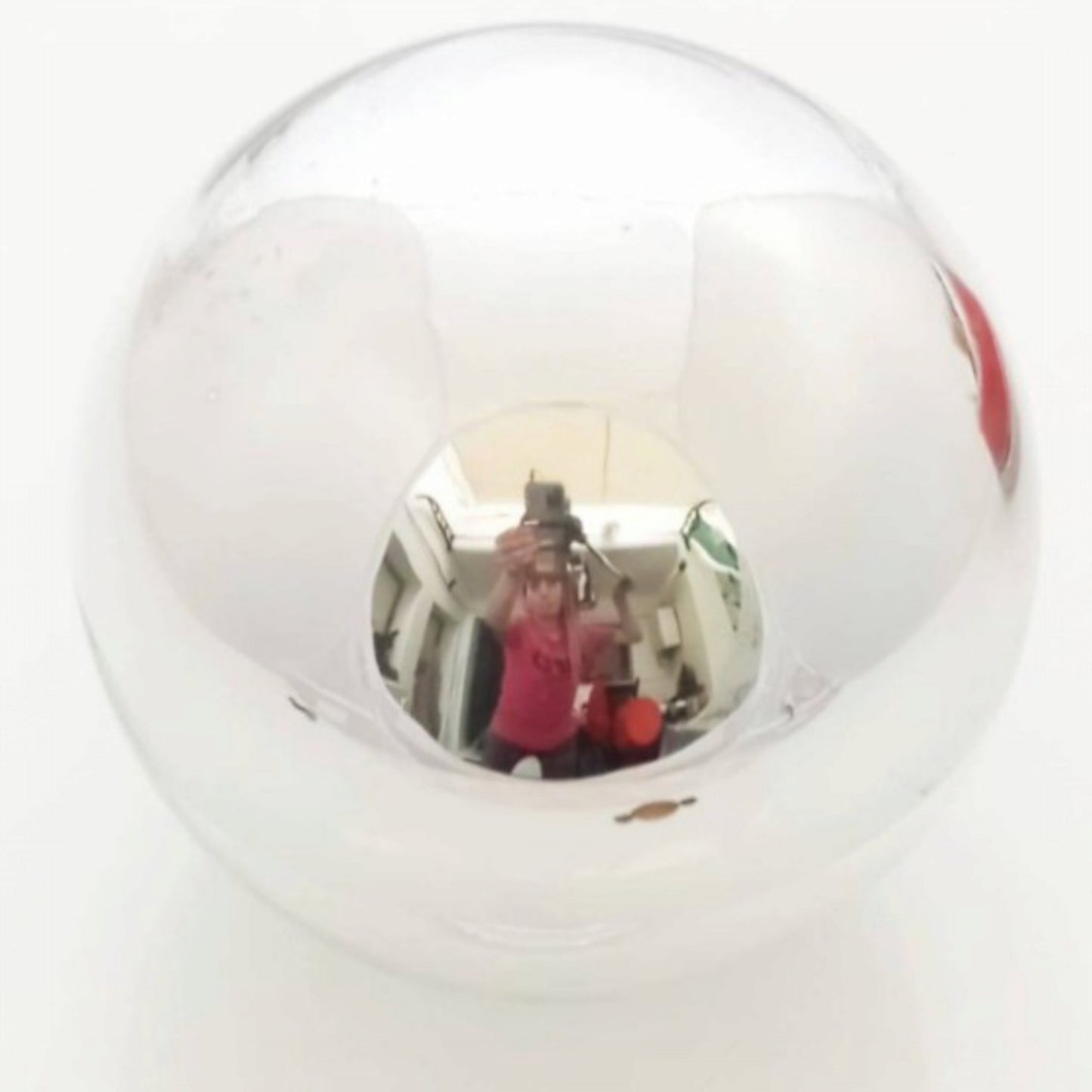 Close view of the clear glass globe and reflective inner fitting 