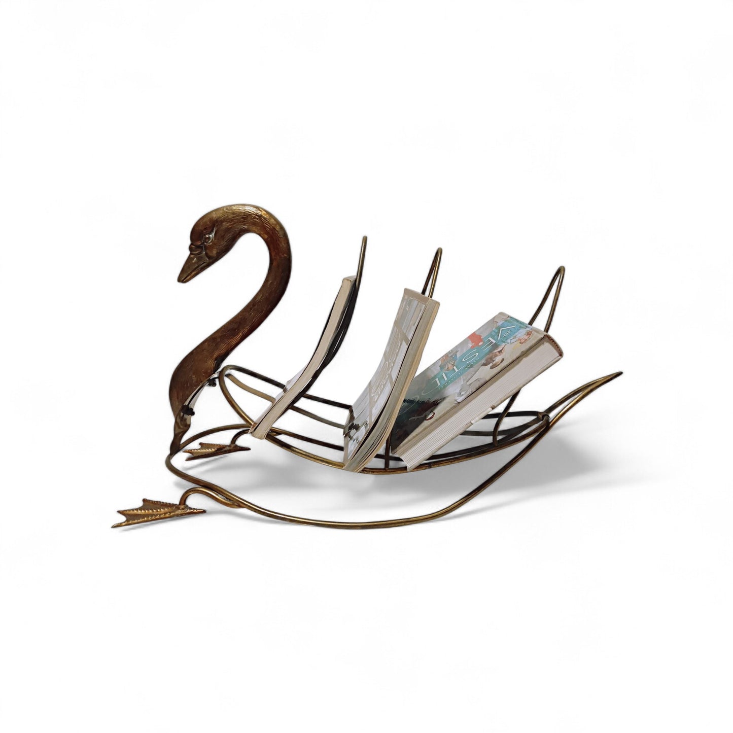 Side view of swan-shaped magazine rack displayed with magazines