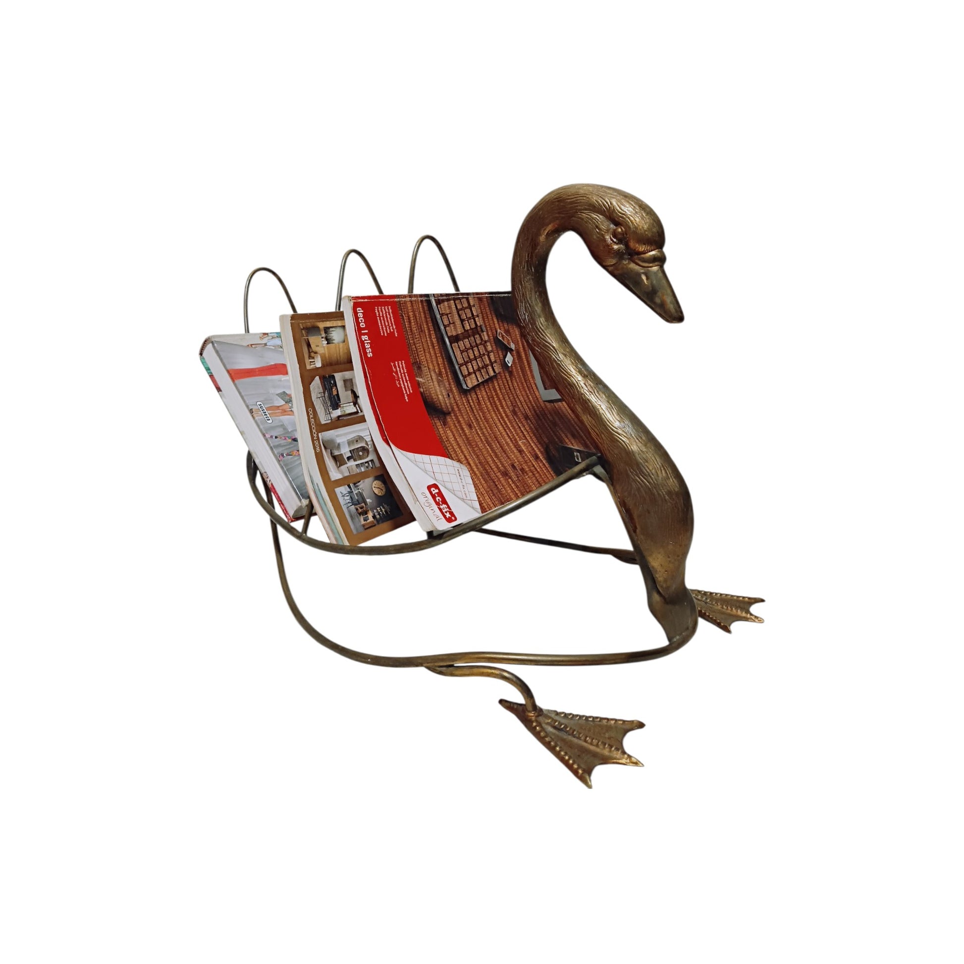 Side view of swan-shaped magazine rack displayed with magazines