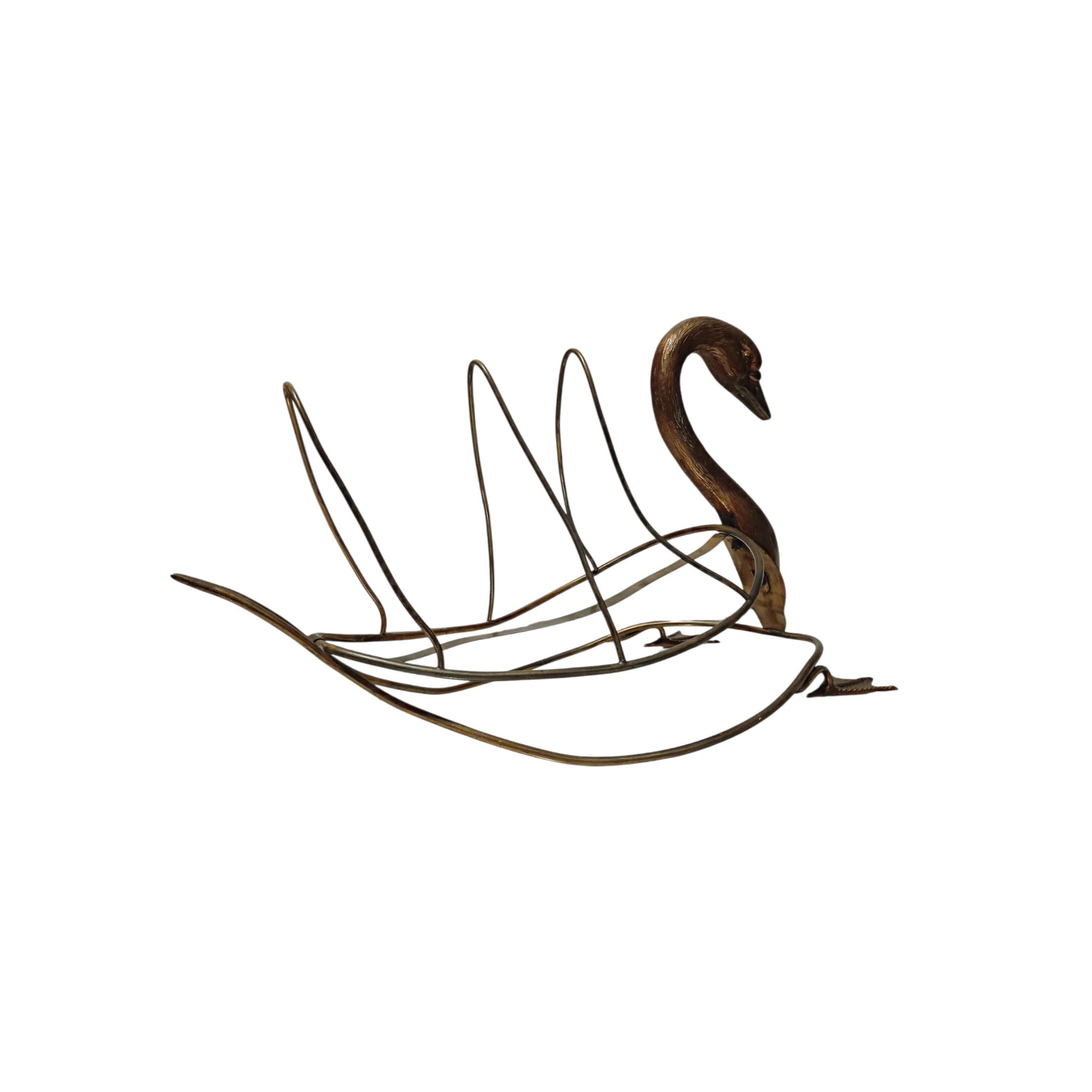 Side view of vintage swan-shaped magazine rack in brass-toned metal 