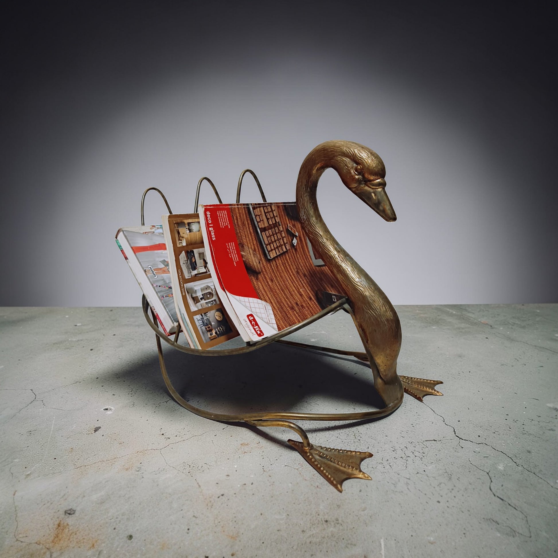 Swan magazine rack displayed in an interior 