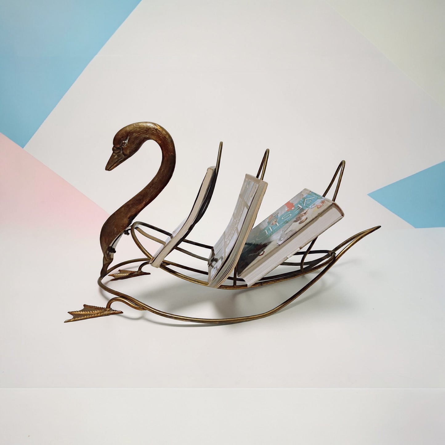 Swan magazine rack displayed with magazines