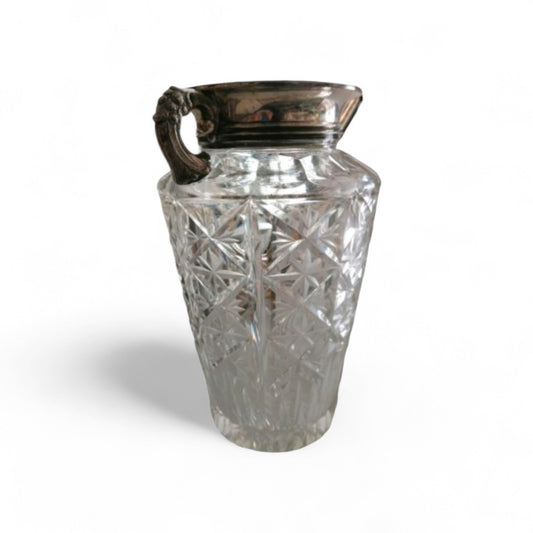 Vintage cut-pattern glass vase with ornate silver-toned metal mount.