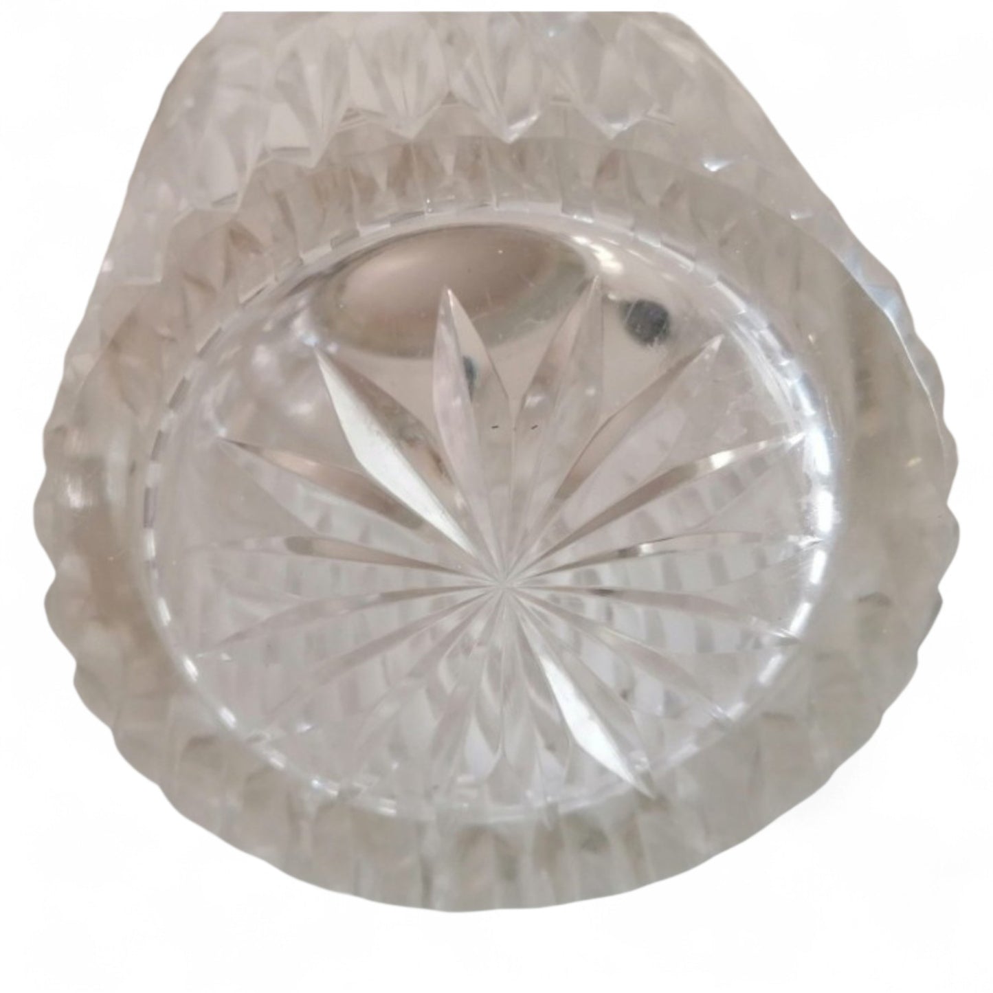 Star-cut pattern on the base of the vintage glass vase.