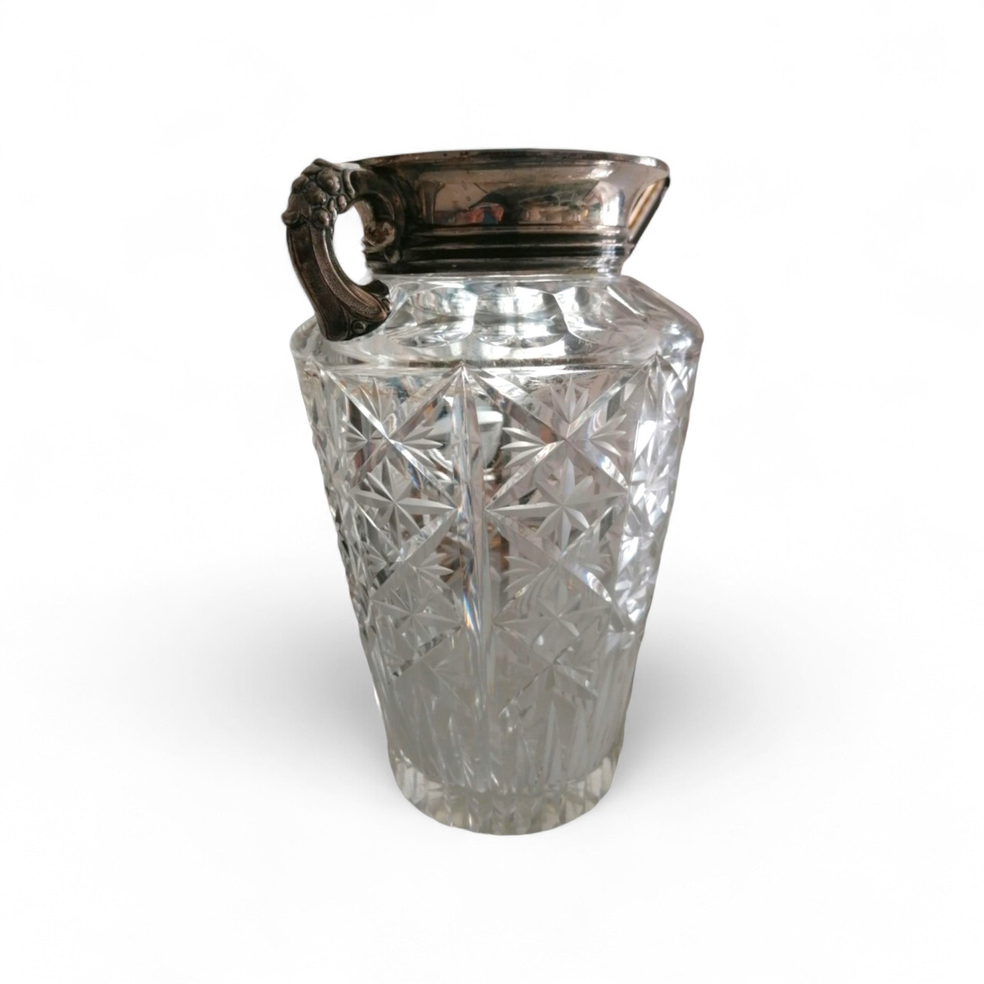Vintage cut-pattern glass vase with ornate silver-toned metal mount.