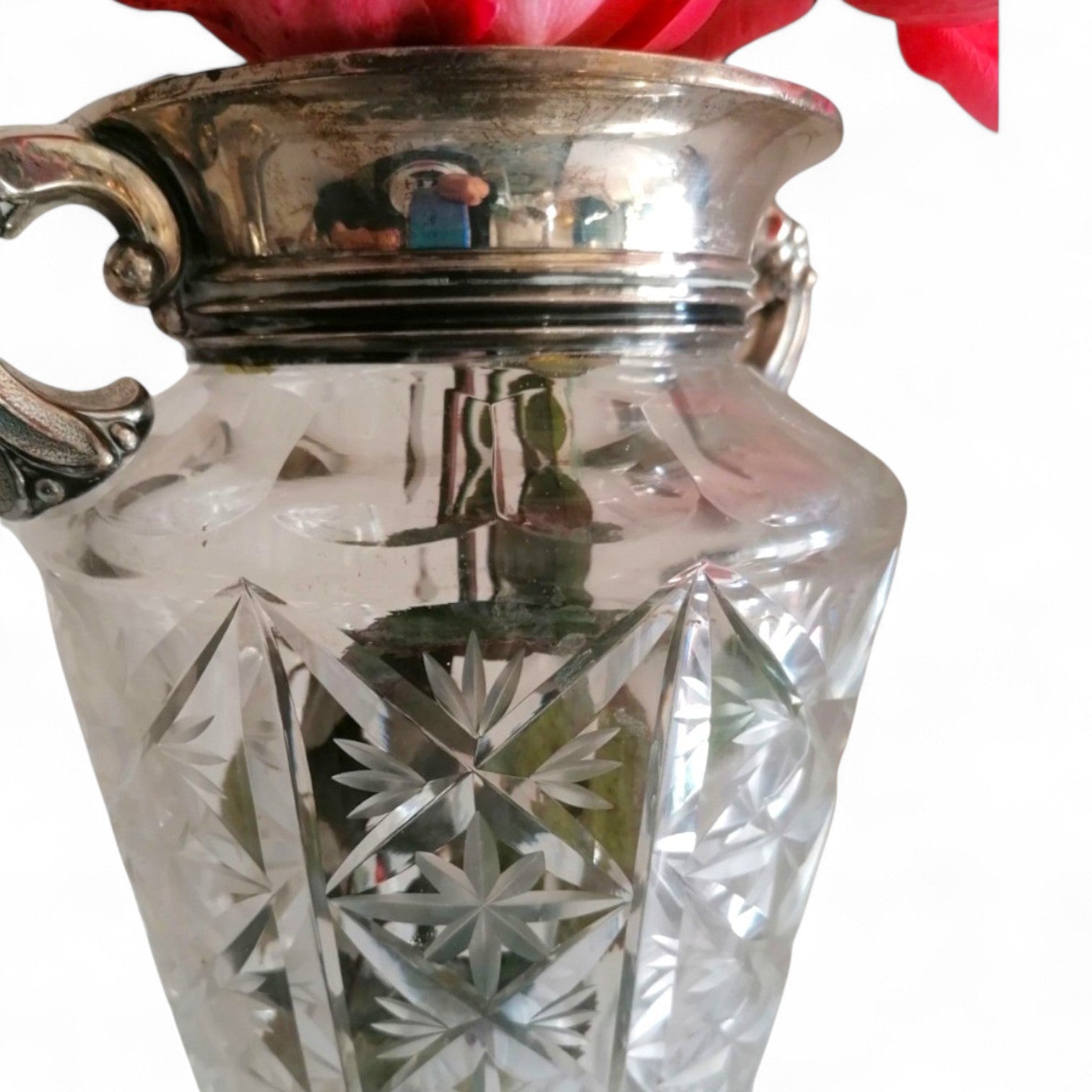 Three-quarter view of the cut-pattern glass vase.