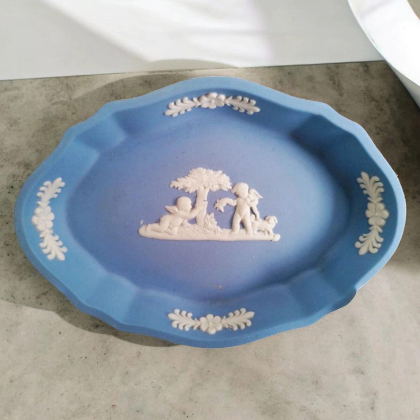 Vintage Wedgwood oval Jasperware dish displayed on pale fabric