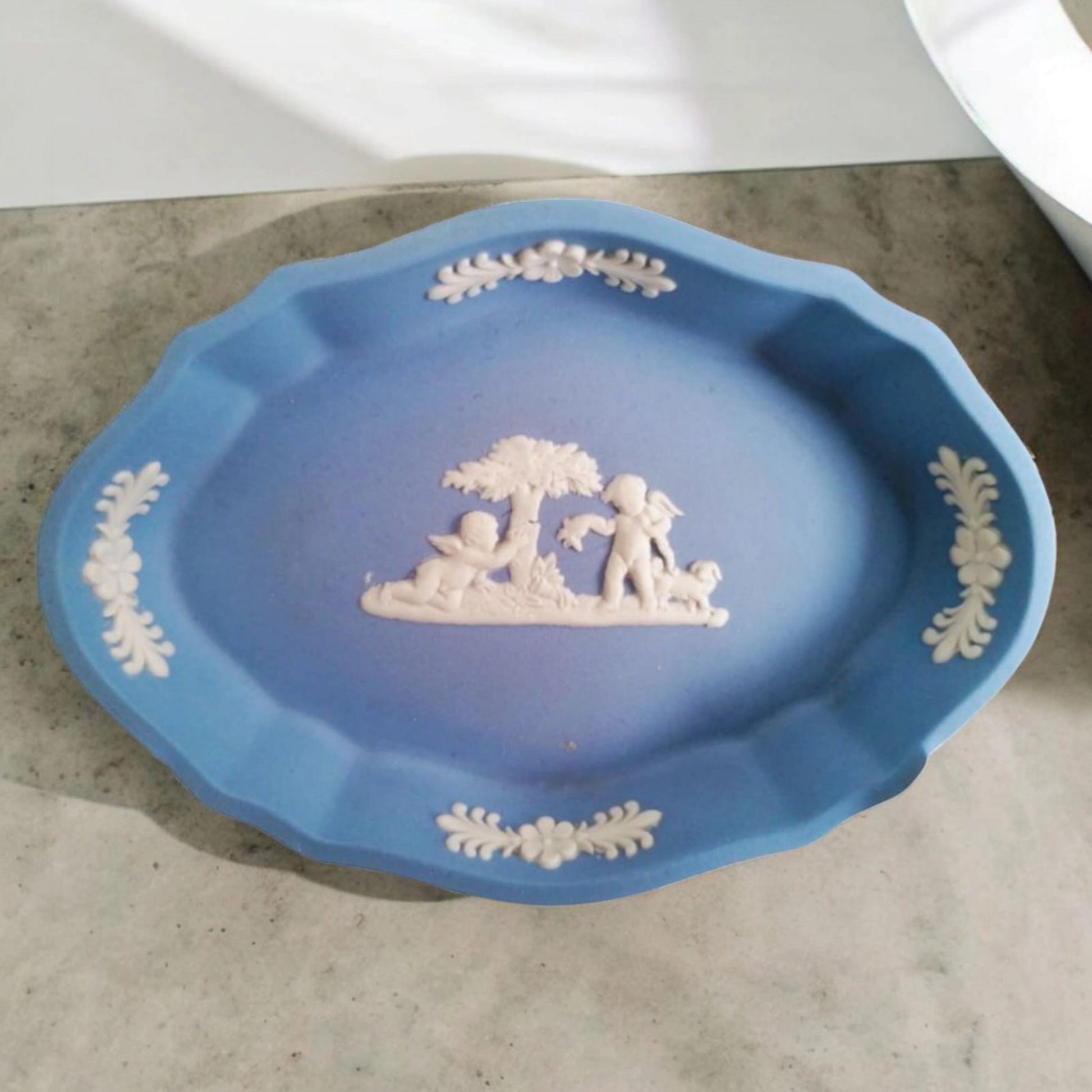 Vintage Wedgwood oval Jasperware dish displayed on pale fabric