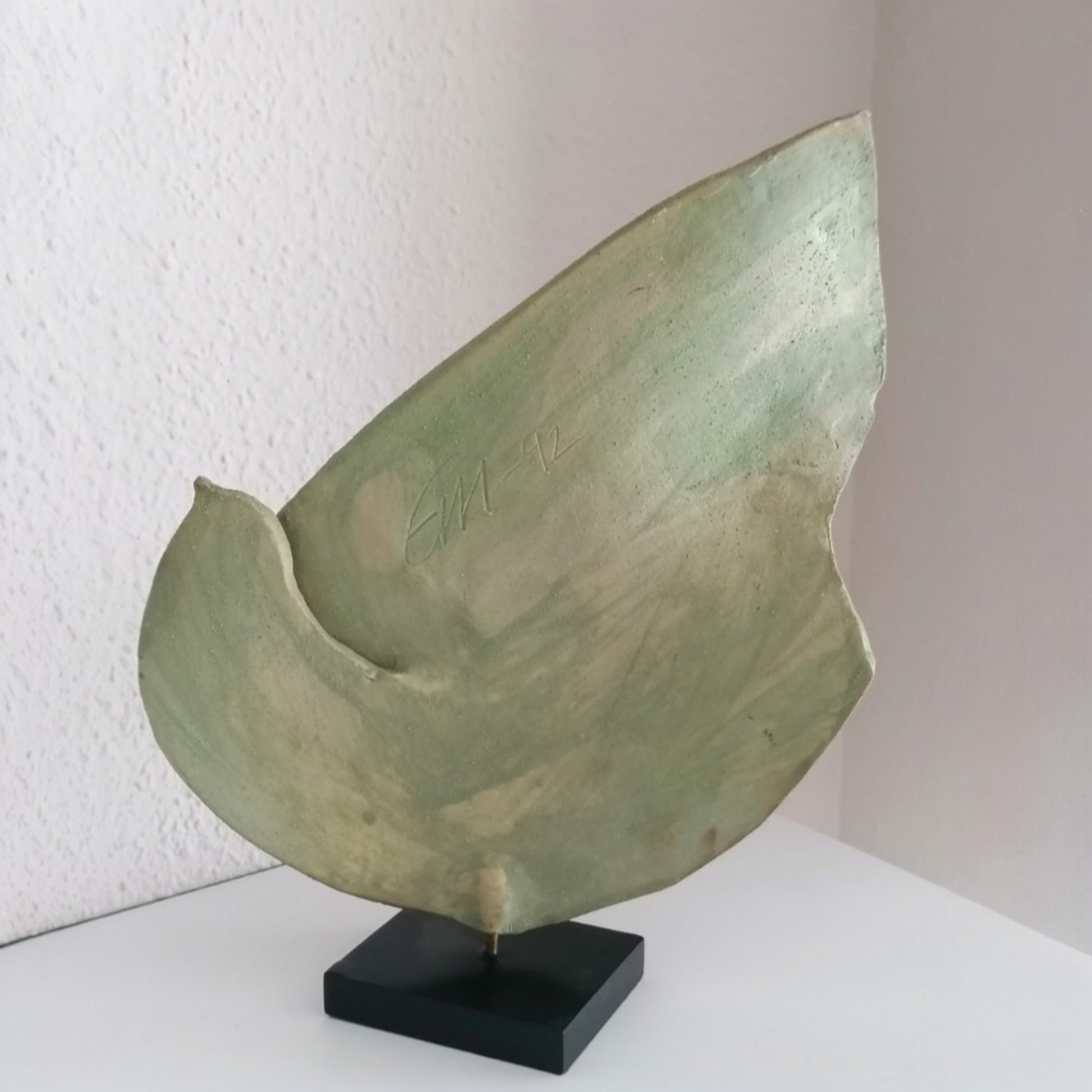 Rear view of the ceramic dove showing the green-grey oxide finish 