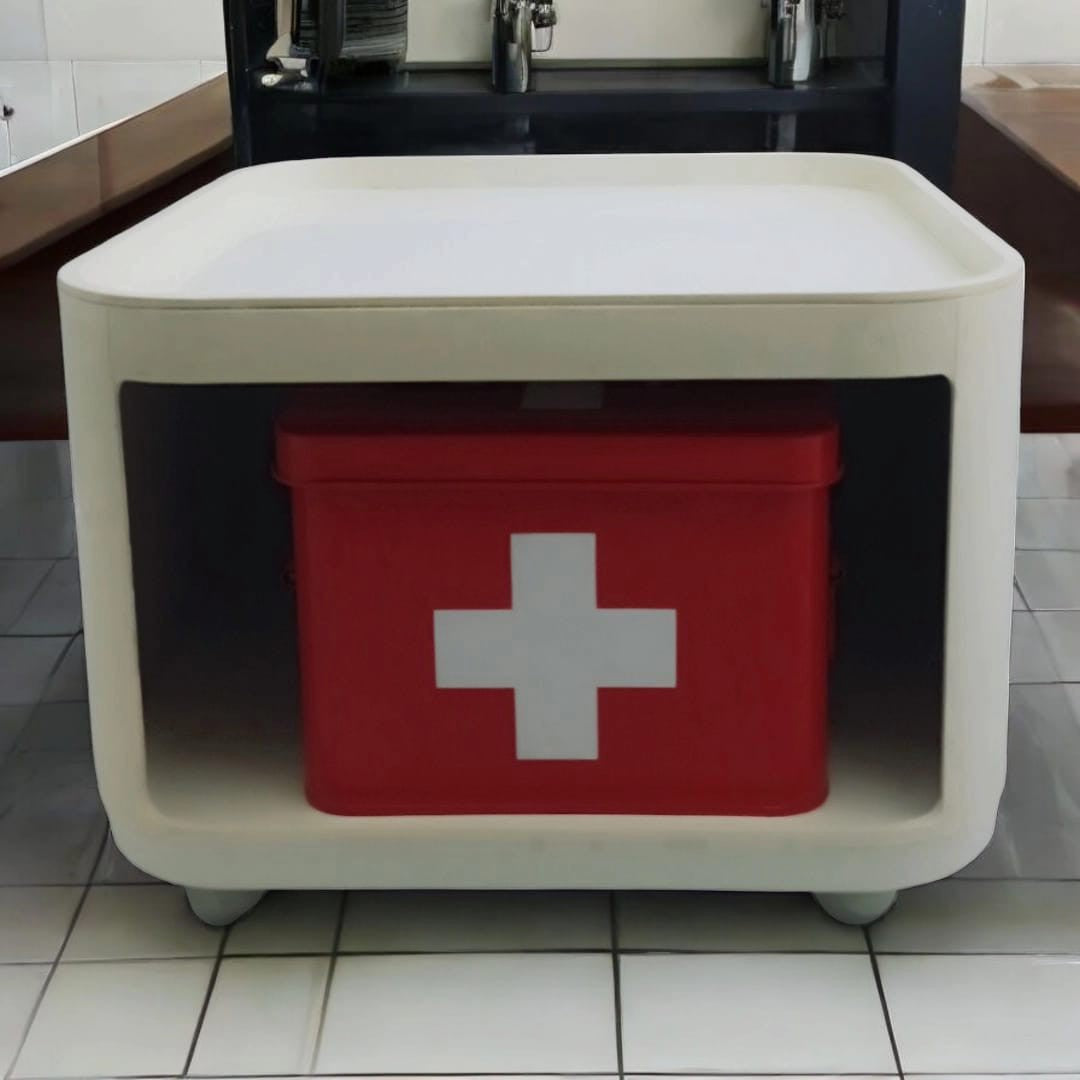 Front view of the modular storage unit with red first aid-style box insert 