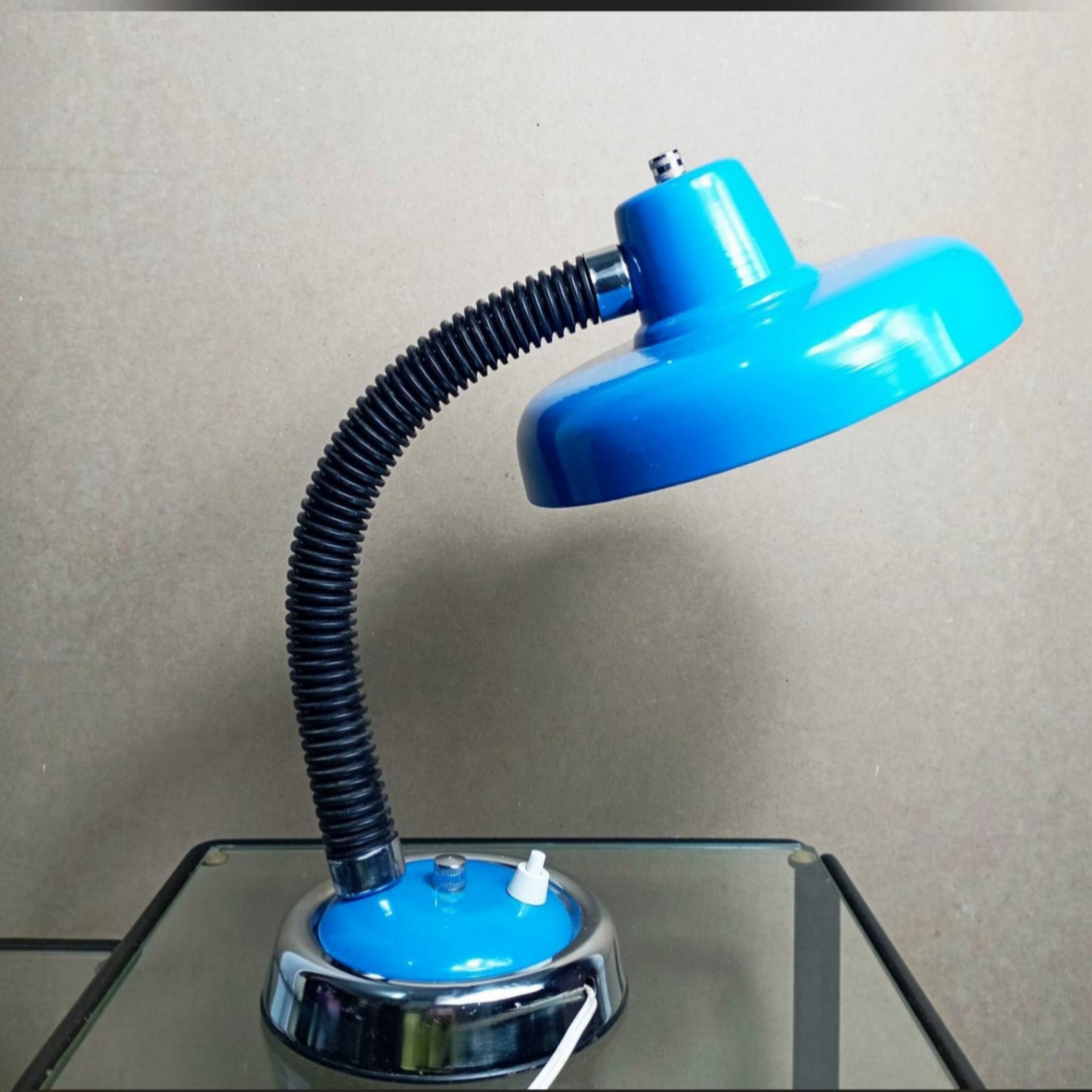 Desk lamp displayed on a glass table