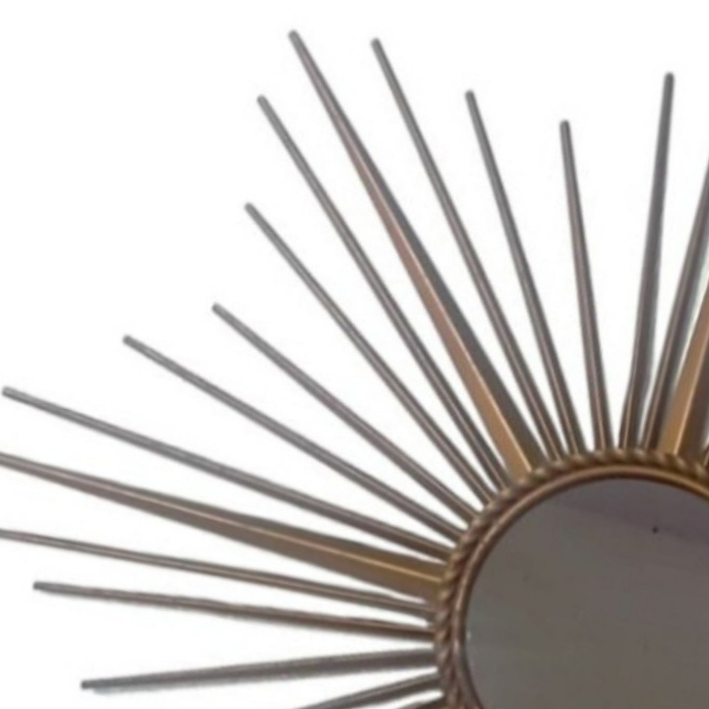 Close-up of the slender metal rays surrounding the circular mirror.