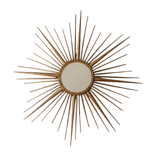 Vintage Vallauris French sunburst wall mirror with radiating metal rays.