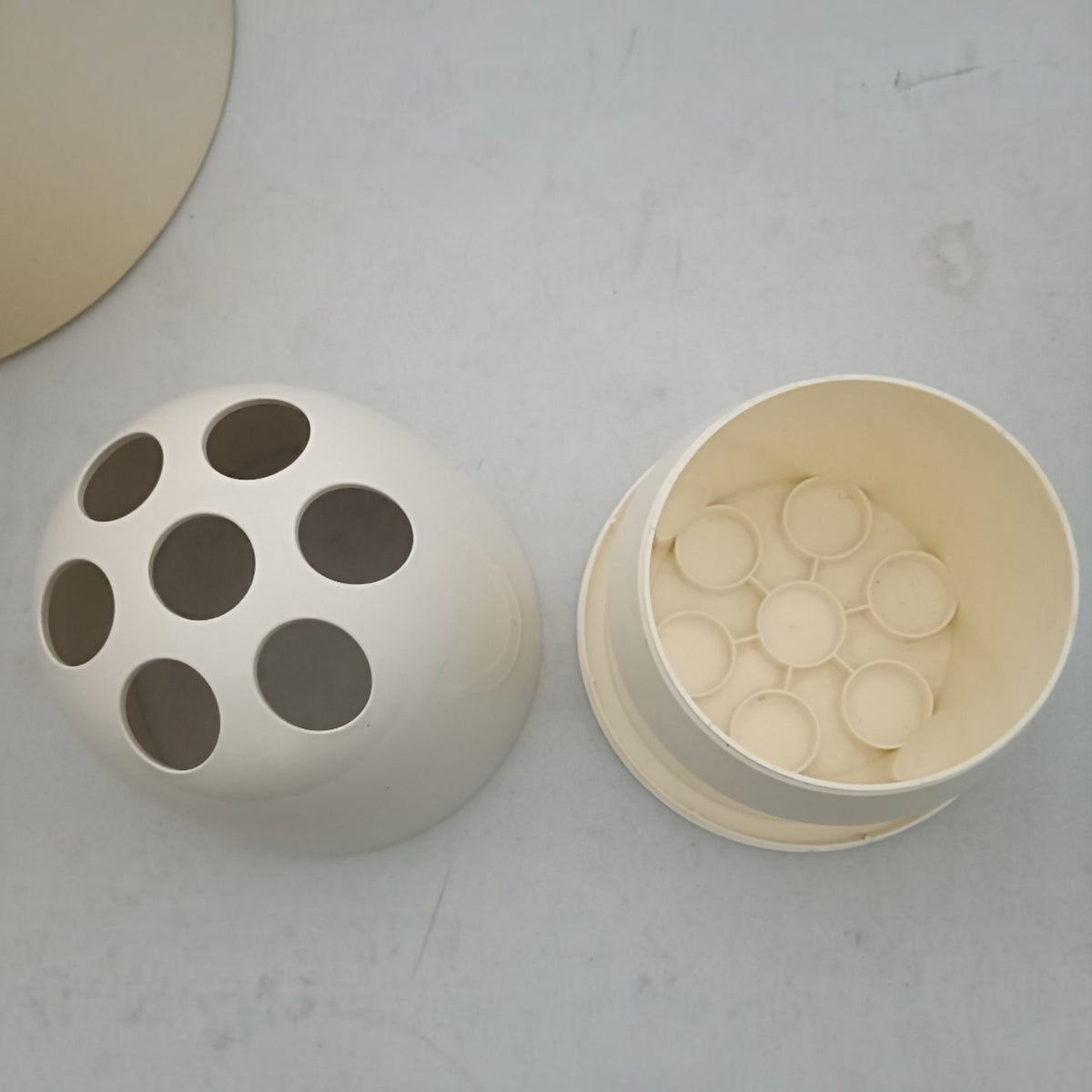 Interior of white Dedalotto vase showing flower holders 