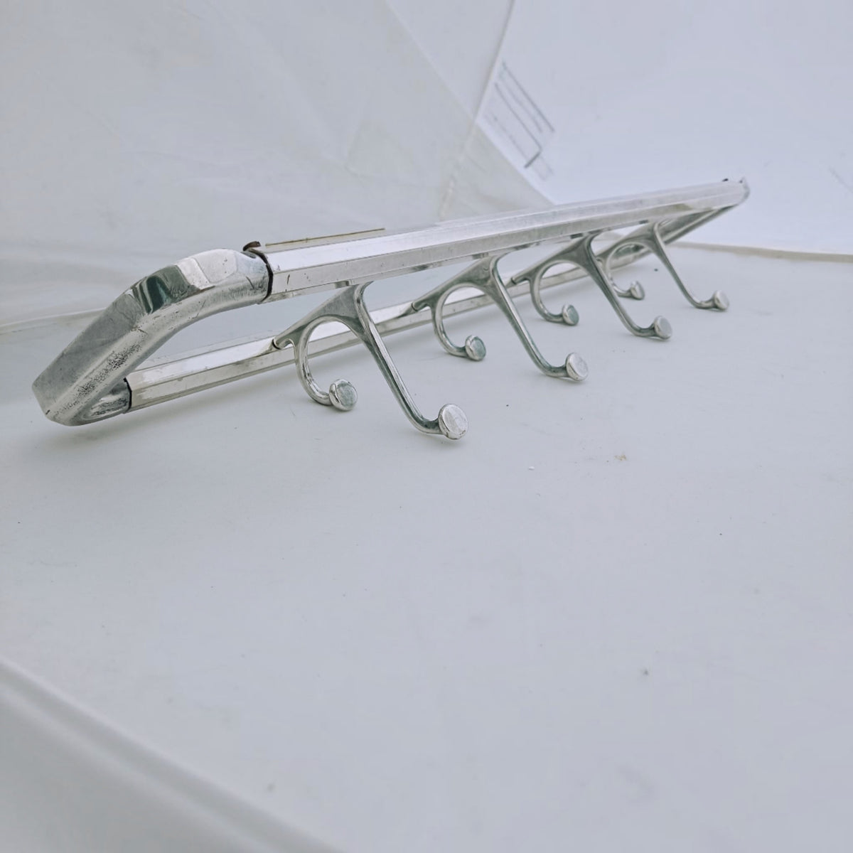 Angled side view showing the projection of the hooks from the frame.