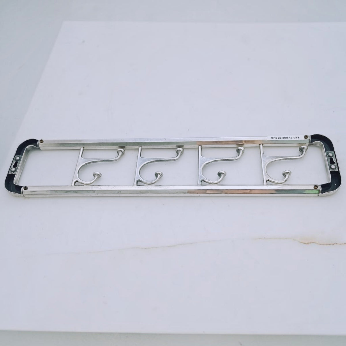 Back view of the long wall coat rack with its hooks aligned.