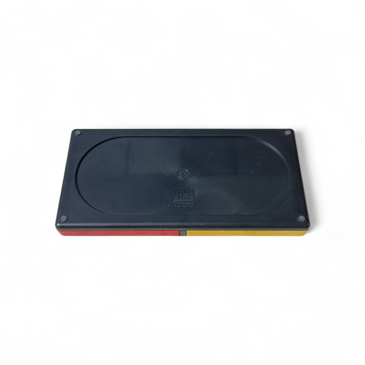 Underside of the black plastic desk organiser showing four round feet and moulded markings