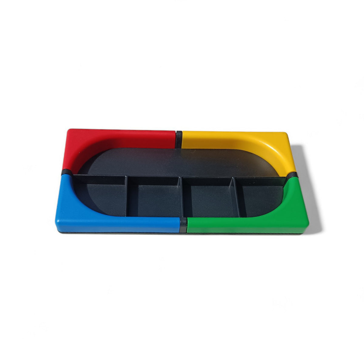 Front  view of the Tino desk organiser with a red, yellow, blue and green frame and black compartments