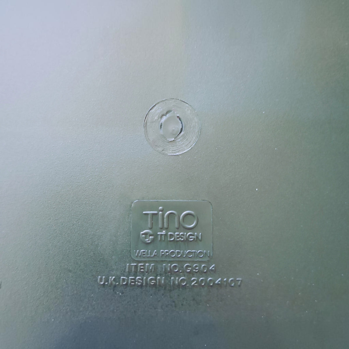 Close-up of the moulded Tino, TT Design, Wella Production, G804 and UK design number 2004107 marks