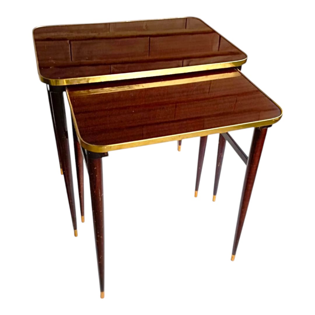 Pair of vintage nesting tables with brass trim