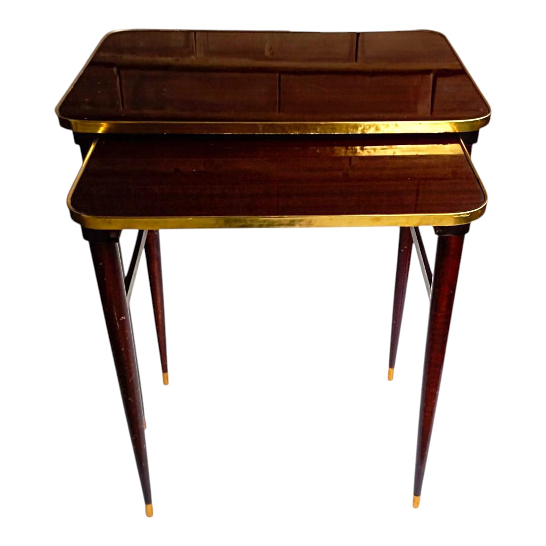 Pair of vintage nesting tables with brass trim