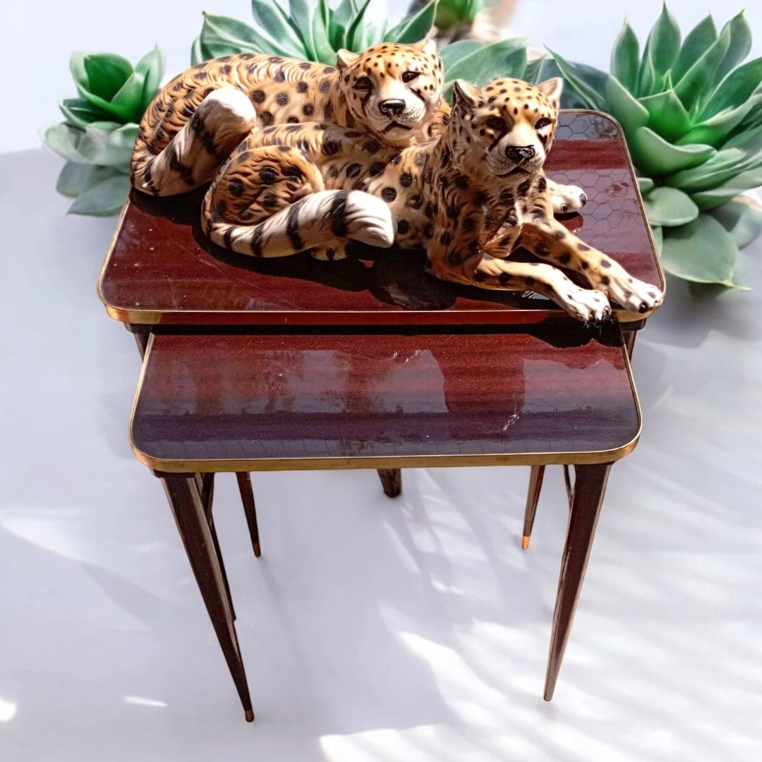 Pair of vintage nesting tables with decorative tigers
