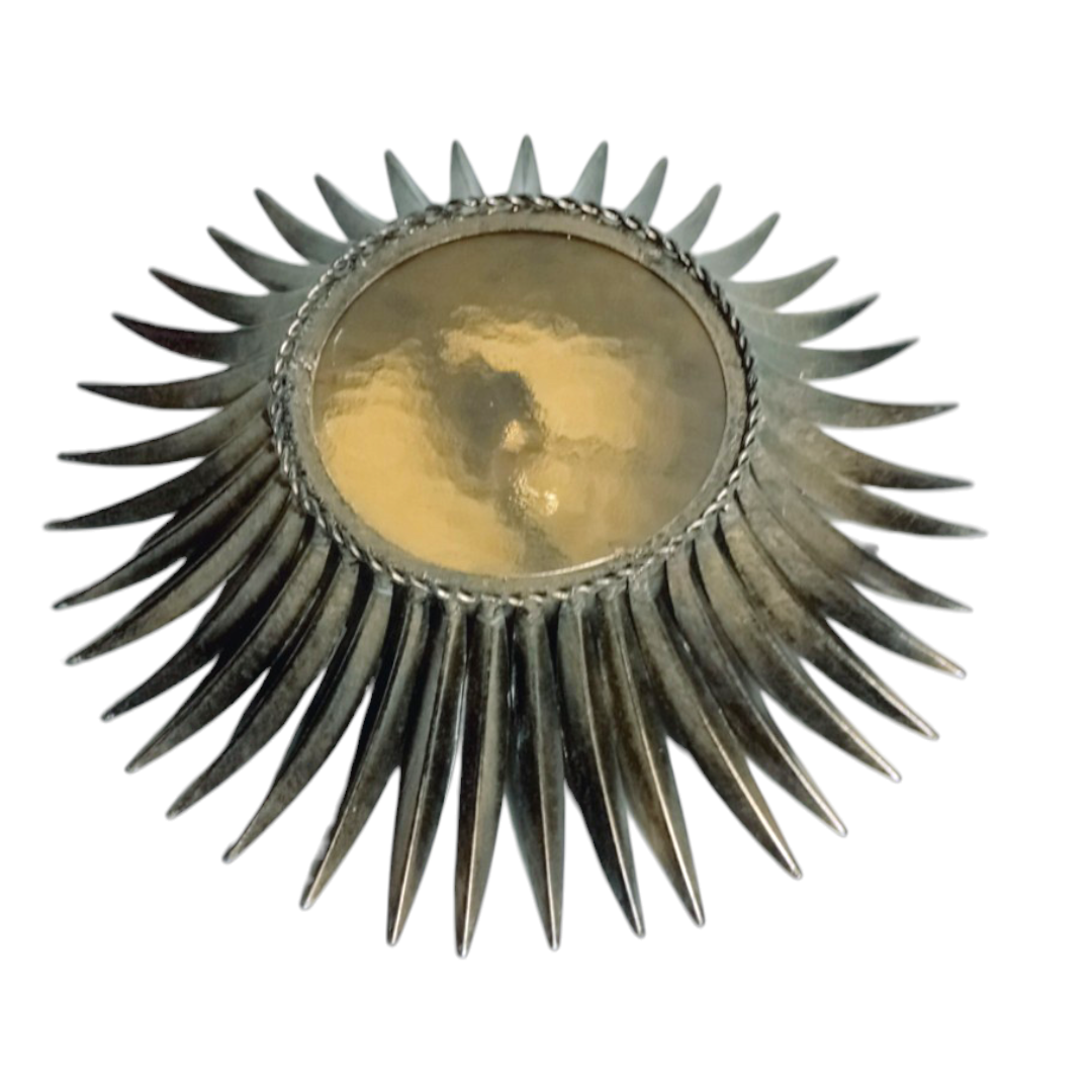 Close-up. 1950s Sunburst lamp with golden glass and radiating metal design