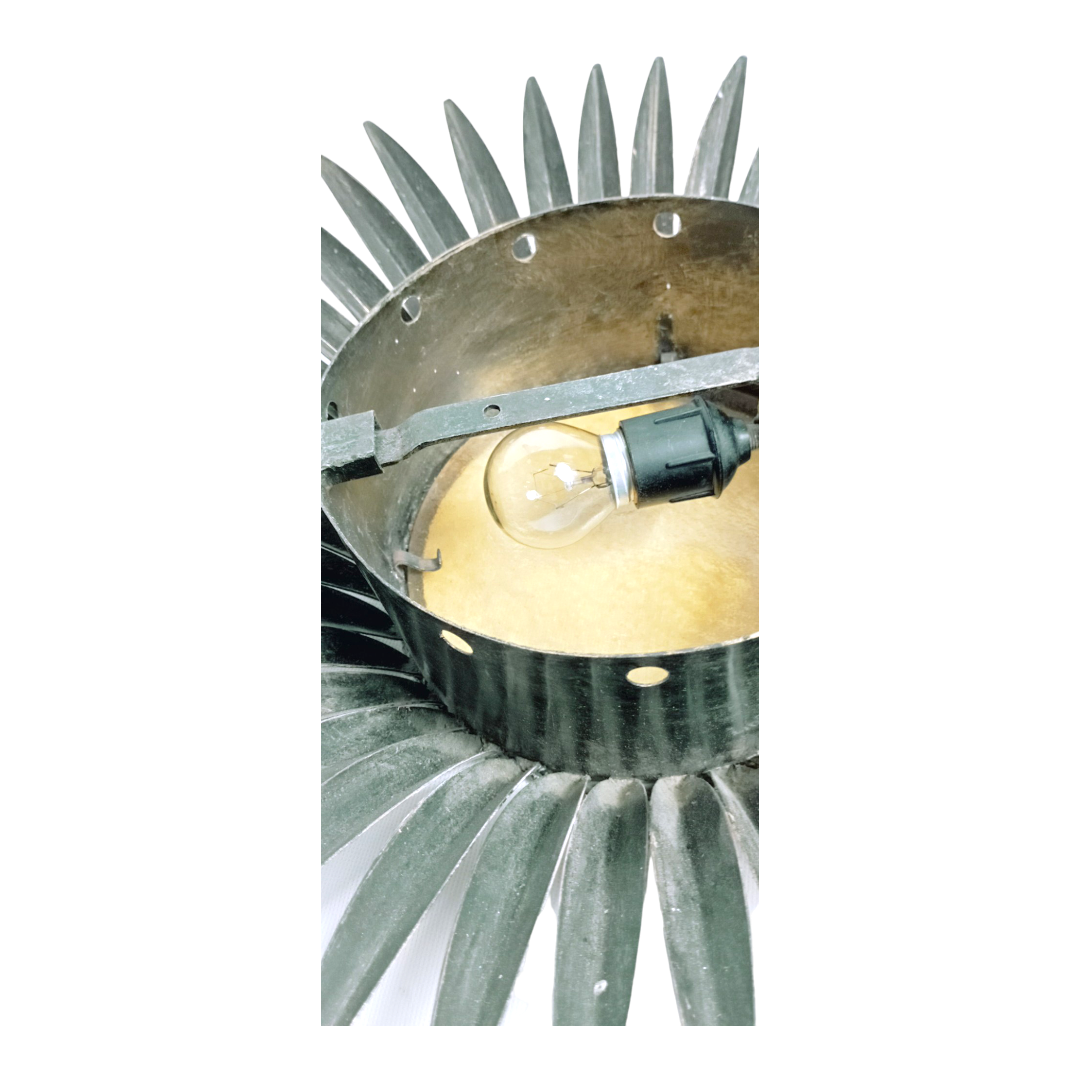 1950s Sunburst lamp with golden glass and radiating metal design. Rear View