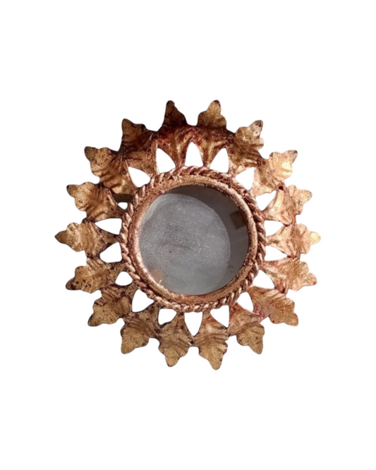 Sunburst lamp front view showing domed centre and gold rays